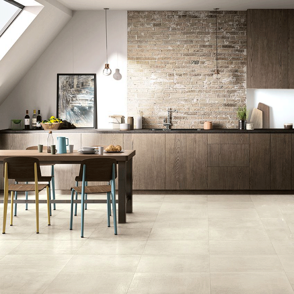 Kitchen In A Loft Style With Concrete And Brick Walls And Tiles A